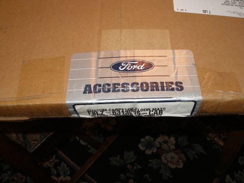 1998 Lincoln Mark VIII - Box containing Ford custom carpeted floor mats, part number F81Z-6313996-CAB.