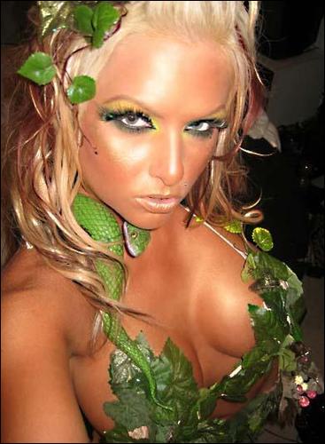 1992 Ford Bronco - A woman poses with a snake and foliage, her makeup and costume are elaborate.