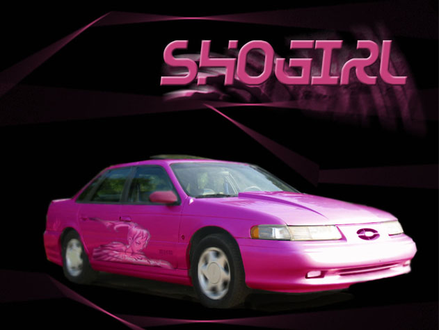 Pink sedan, possibly a 1994 Ford Taurus, with graphics on the side and "SHO GIRL" text above