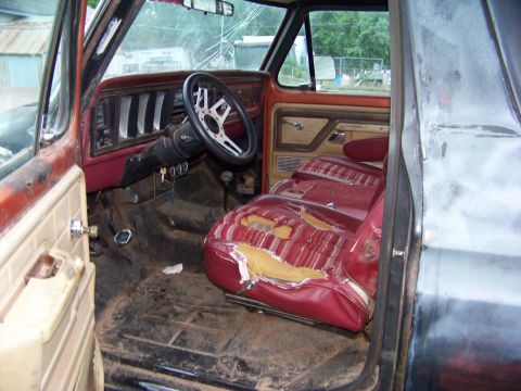 1979 Ford Bronco - The interior of a 1978 Ford Bronco shows worn seats and a dirty cabin.
