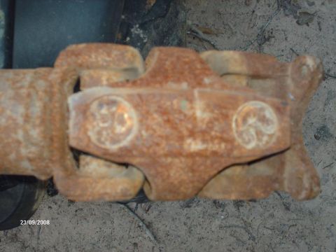 1990 Ford F-150 - A heavily rusted driveshaft universal joint is shown in detail, with visible grease fittings.
