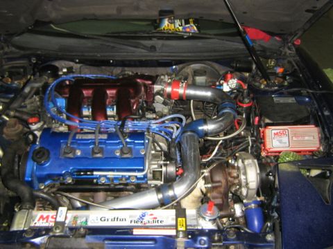 1995 Ford Probe - Customized engine bay a turbocharger and aftermarket parts.