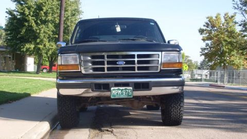 1996 Ford Bronco - The front grille and headlights suggest a 1992-1996 Ford Bronco model.
