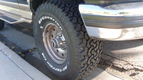 1996 Ford Bronco - Tire detail shot showing BFGoodrich All-Terrain T/A tread pattern and wheel.
