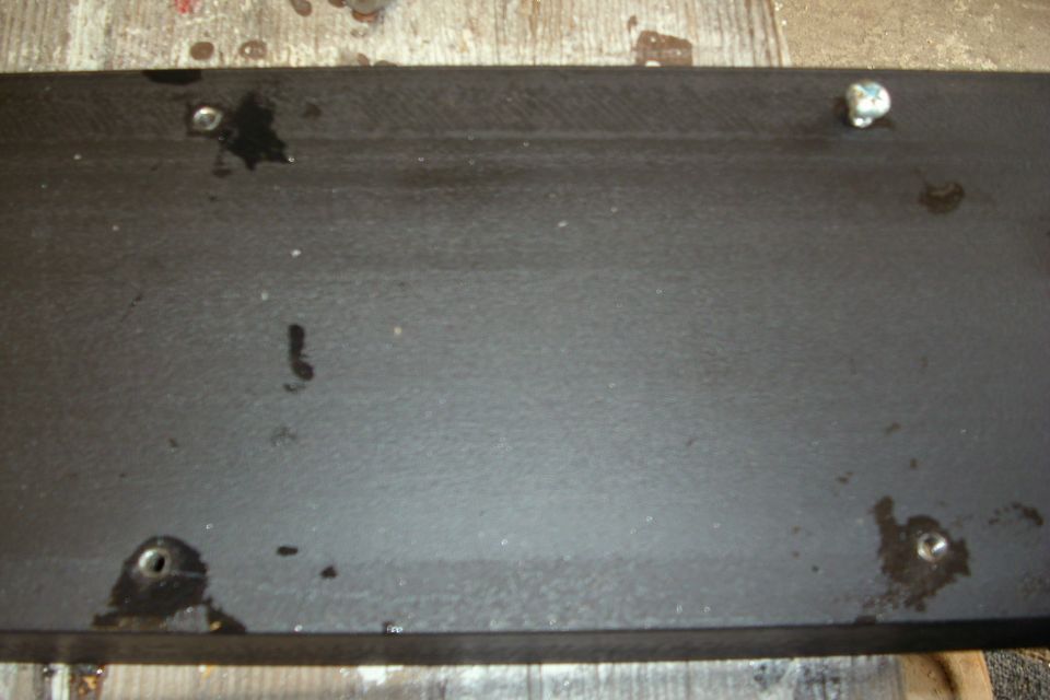 License plate bolt hole