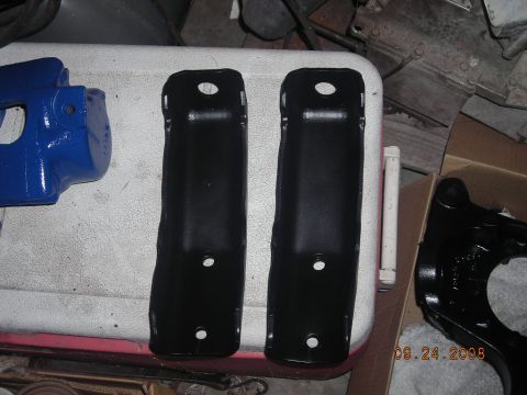 1993 Ford Bronco - Several automotive parts are laid out on a surface, with a watermark indicating the date and website.