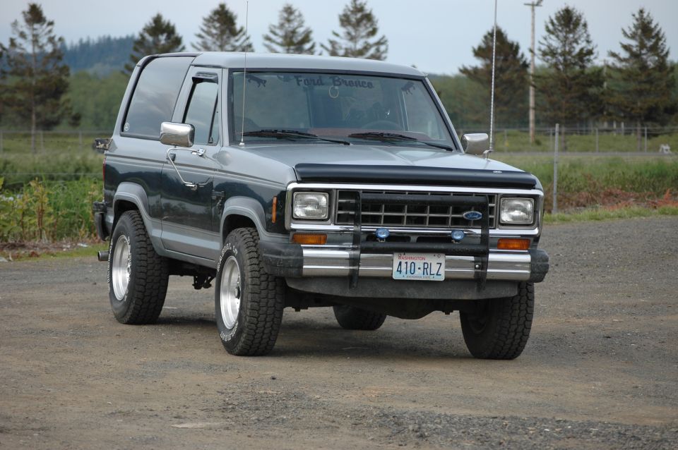 1984 Ford Bronco II parked on gravel, front view. License plate 410-RLZ