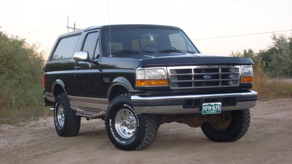 Black 1996 Ford Bronco with lifted suspension and chrome wheels