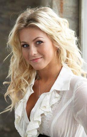 1996 Ford Bronco - Woman with blonde curly hair and hoop earrings wears a white ruffled blouse.