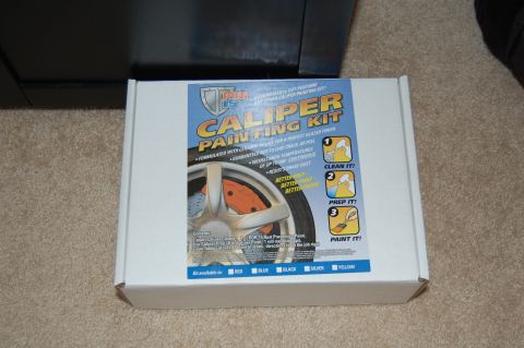 2002 BMW M3 - This box displays a caliper painting kit, a wheel with orange brake calipers and instructions for application.