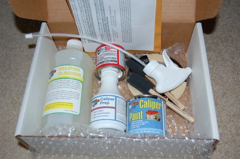 2002 BMW M3 - A caliper paint kit is shown, containing various cleaning and painting supplies for automotive brake calipers.
