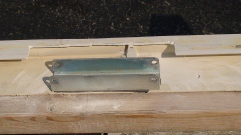 1979 Ford Bronco - A close-up view shows a metal bracket attached to a wooden surface, with the SuperMotors logo visible at the bottom right.