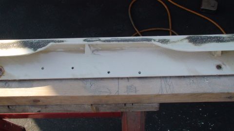 1979 Ford Bronco - A custom fiberglass part is being worked on, resting on wooden supports.