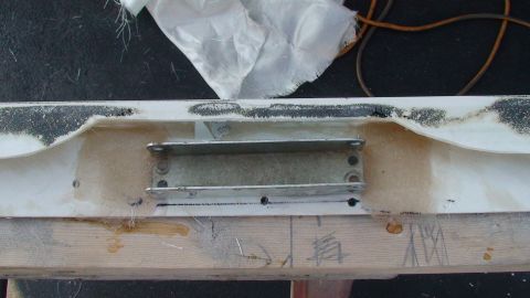 1979 Ford Bronco - A fiberglass part with metal brackets is shown, likely part of a soft top conversion project.