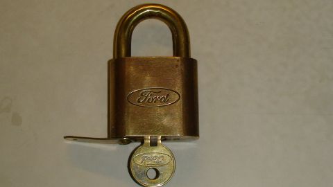 1979 Ford Bronco - Padlock with Ford logo and key. The album claims it is a 1979 Ford Bronco part.