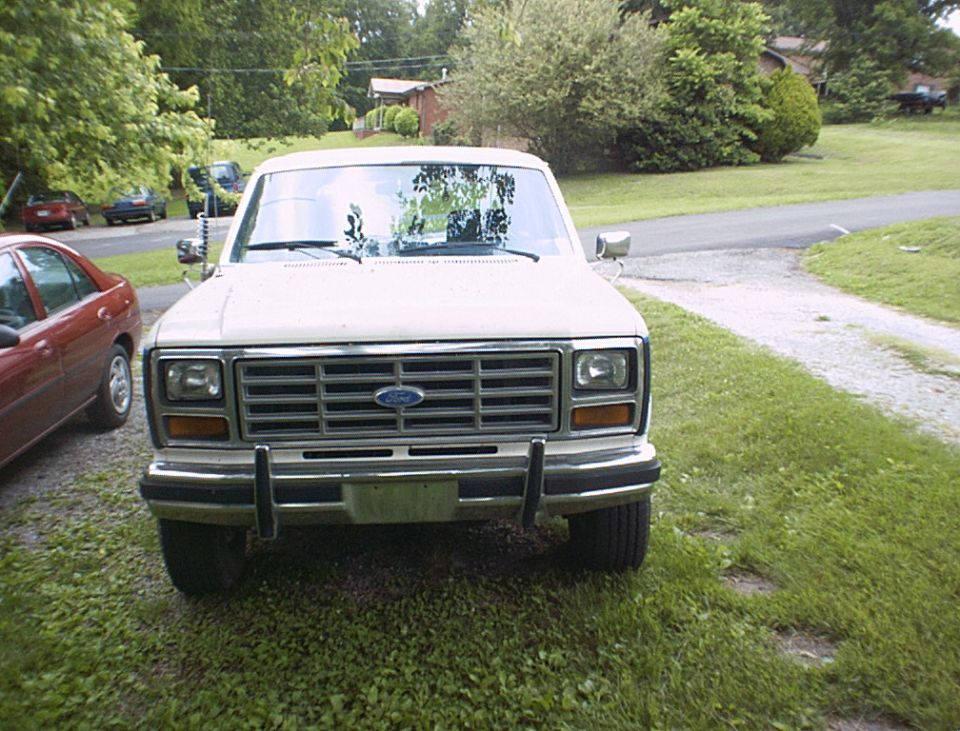 Front view of a white Ford F-Series truck, likely from the early 1980s