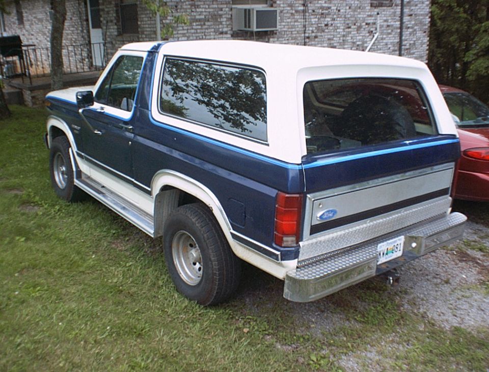 Blue and white 1986 Ford Bronco rear 3/4 view