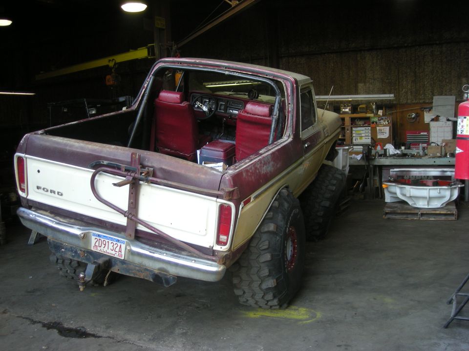 1979 Ford Bronco rear view with large tires and red interior
