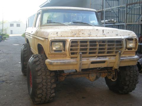 1979 Ford Bronco - This 1979 Ford Bronco is heavily modified with oversized tires and appears to be undergoing a substantial build.
