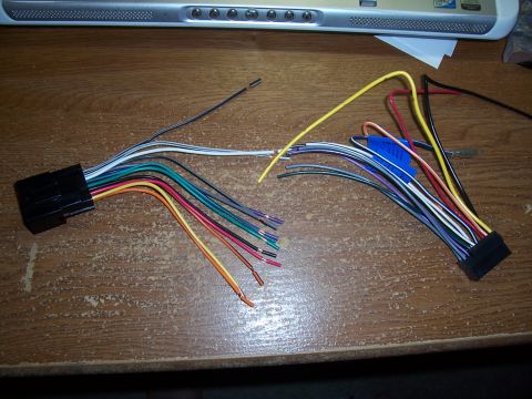2003 Ford Ranger - Wiring harness for a car stereo, showing a variety of colored wires connected to a black connector.