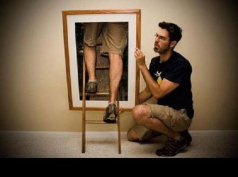 2000 Mercury Grand Marquis - A man is framed by a picture, appearing to climb a ladder within the image.