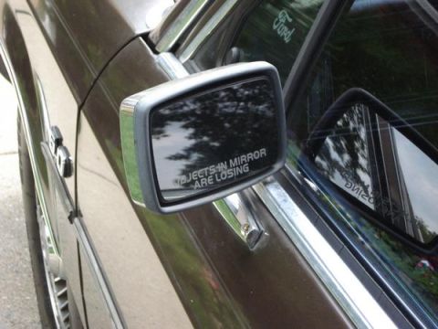 1988 Mercury Grand Marquis - The side mirror on this vehicle has a warning that objects are closer than they appear.