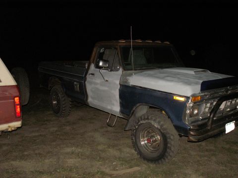 1977 Ford F-250 - This 1977 Ford F-250 pickup truck is seen at night, with its hood prepped for paint.