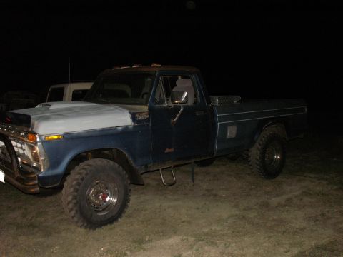 1977 Ford F-250 - This 1977 Ford F-250 pickup truck features a custom hood scoop and off-road tires.