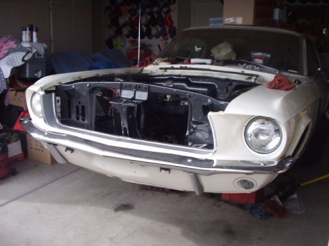 1967 Ford Mustang - Front view of a white 1967 Ford Mustang with its hood open, revealing the engine compartment.