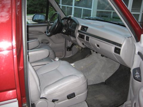 1996 Ford Bronco - Interior view of a 1996 Ford Bronco, grey leather seats and dashboard.