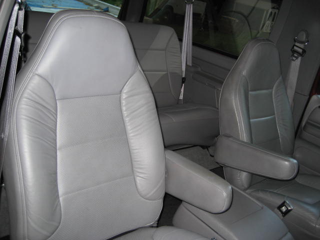 Gray leather bucket seats with armrests inside a 1996 Ford Bronco