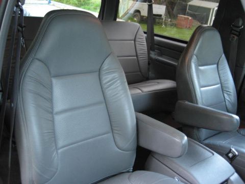1996 Ford Bronco - Interior view of a 1996 Ford Bronco, highlighting the gray leather seating.