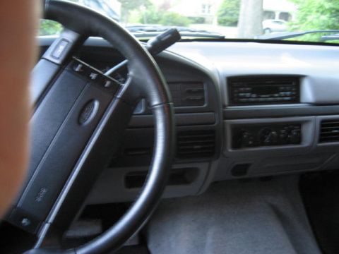 1996 Ford Bronco - Interior view of a 1996 Ford Bronco, showing the steering wheel and dashboard details.