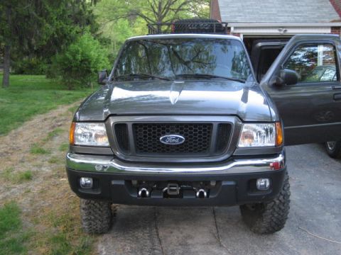 2004 Ford Ranger - Front view of a 2004 Ford Ranger parked in a driveway with the driver's door open.