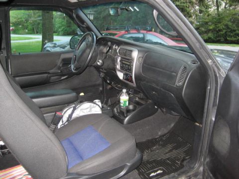 2004 Ford Ranger - Interior view of a 2004 Ford Ranger, highlighting the driver's side dashboard and seating area.