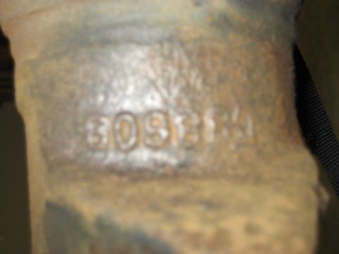 1996 Ford Bronco - Stamped numbers on a metal part.