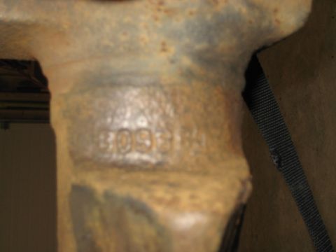 1996 Ford Bronco - A close-up shows stamped numbers on a heavily rusted metal component.