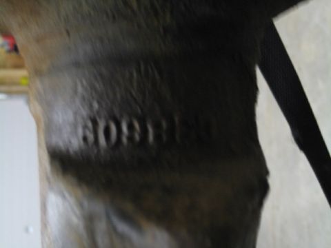 1996 Ford Bronco - Embossed text on a metal vise reads "60911".