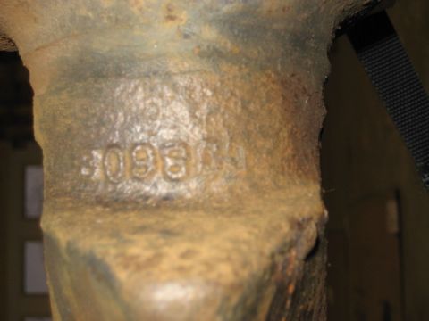 1996 Ford Bronco - A close-up view of a heavily rusted metal component, showing the stamped numbers '3096'.