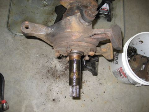1996 Ford Bronco - Close-up of a heavily rusted vehicle spindle assembly, likely from a truck or SUV.