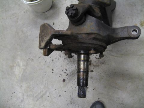 1996 Ford Bronco - Close-up view of a front axle spindle and knuckle assembly, showing the splined shaft.
