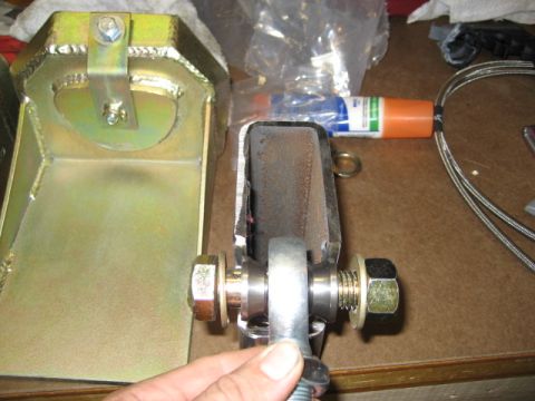 1996 Ford Bronco - Metal bracket and linkage assembly with hardware, possibly for automotive repair or modification.