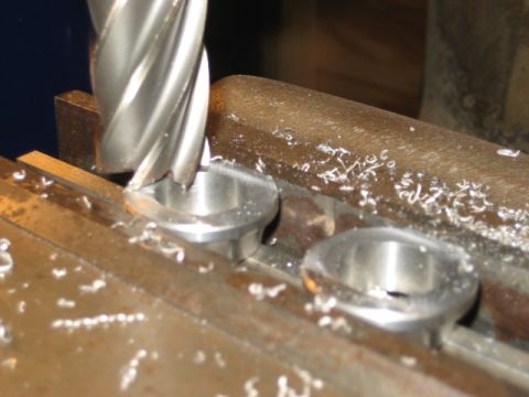 1996 Ford Bronco - A milling machine is shown in operation, cutting into metal components.