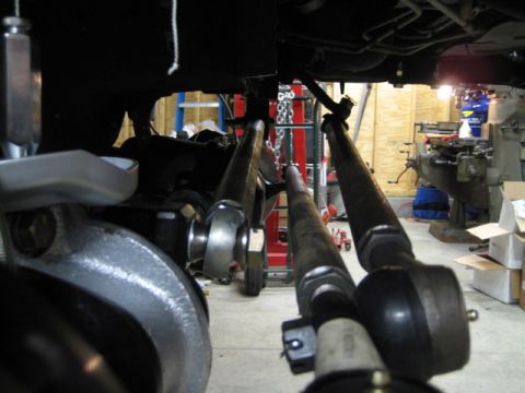 1996 Ford Bronco - Workshop view of automotive steering and suspension components, possibly for a Ford Bronco.