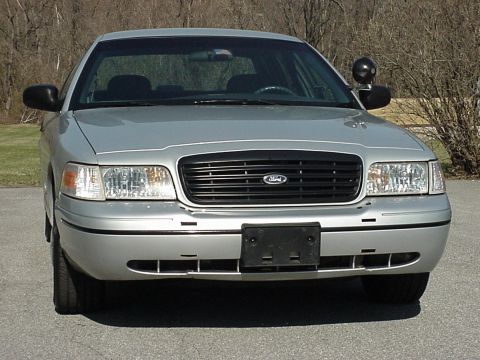 2000 Ford Crown Victoria - Front view of a silver 2000 Ford Crown Victoria parked outdoors.