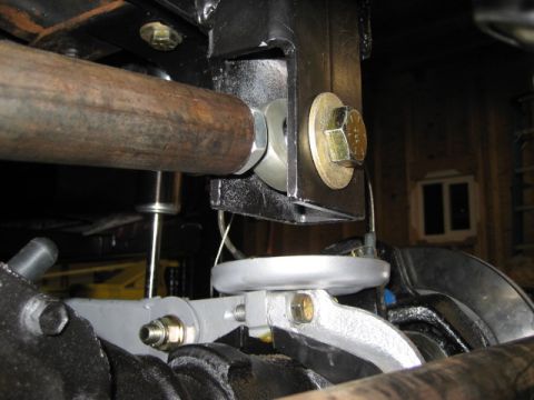 1996 Ford Bronco - Detailed view of vehicle suspension parts, showing metal brackets and bolts.