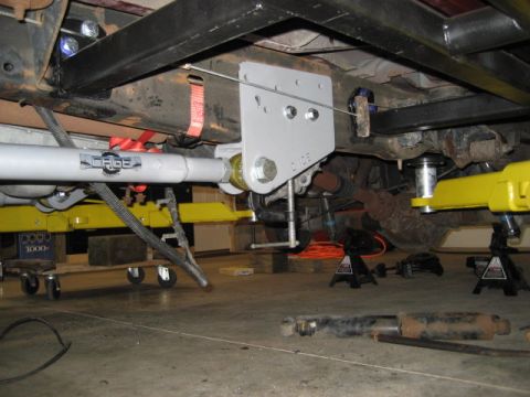 1996 Ford Bronco - Close-up of a vehicle's undercarriage showing suspension components and modifications.