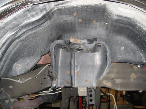 1996 Ford Bronco - Underside view of a vehicle's wheel well, showing suspension and frame elements.