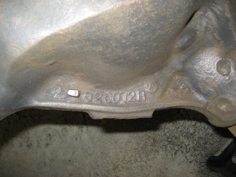 1996 Ford Bronco - A close-up view of a metal casting shows stamped identification numbers.