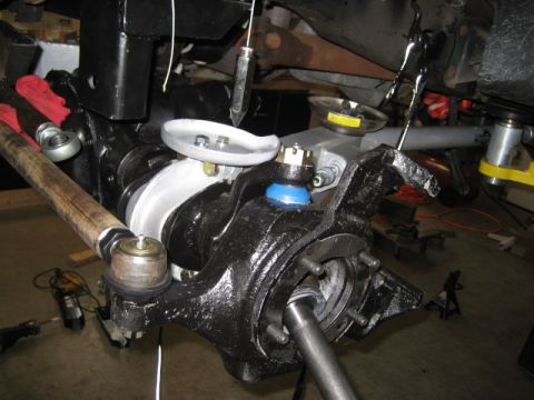 1996 Ford Bronco - This image shows a close-up view of a vehicle's front suspension assembly, highlighting various components.